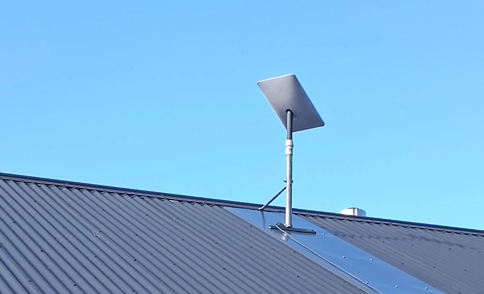 Starlink installer in Midland fitting roof mount and cable run